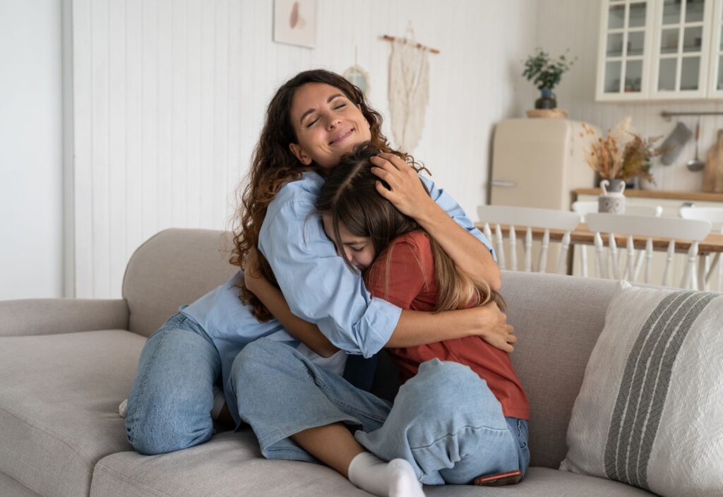 Mom Hugging Daughter