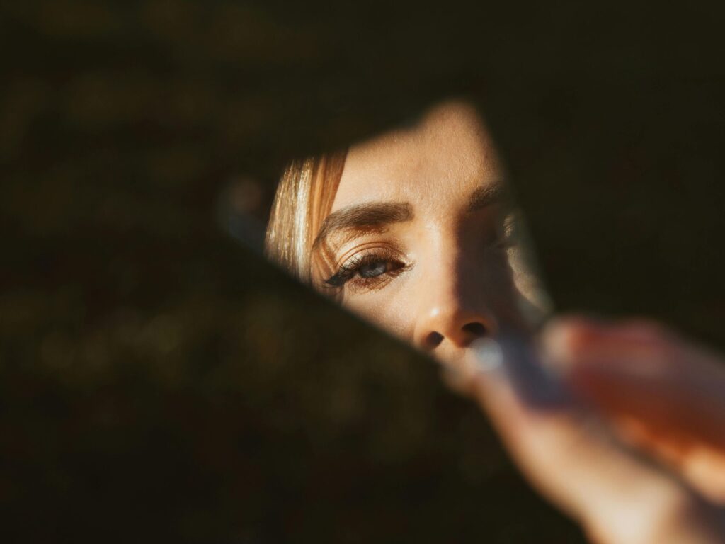 Woman holding a fragmented piece of glass
