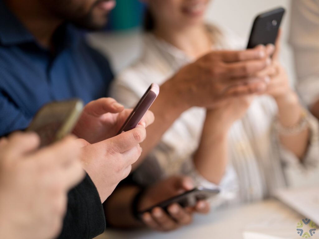 multiple people on their phones